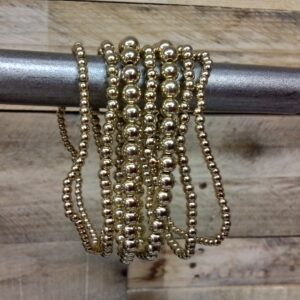 Gold Stretch Brac Set 7 pc. plastic 1900